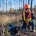 Local worker establishing white birch (Betula papyrifera) within wildfire scorched land, Kakisa, NWT.